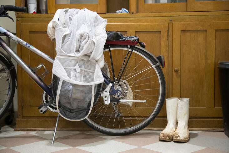 bee suit and boots on bike