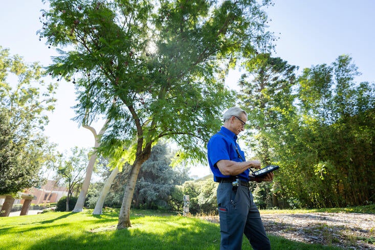 Mark Jones in front of trees