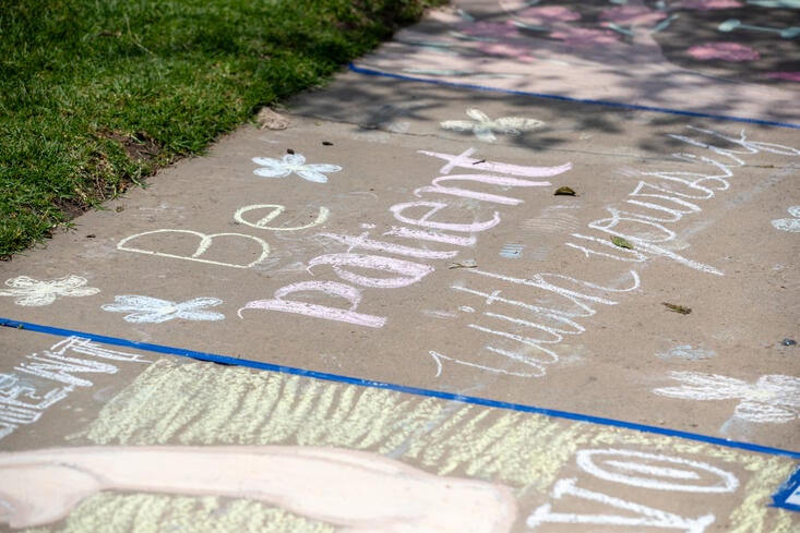 Chalk art with a supportive phrase