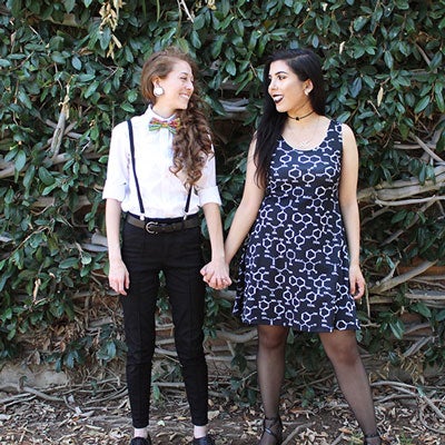 Sonia ’19 & Mariah ’19 UCR couple Sonia & Mariah stand holding hands in front of Watkins