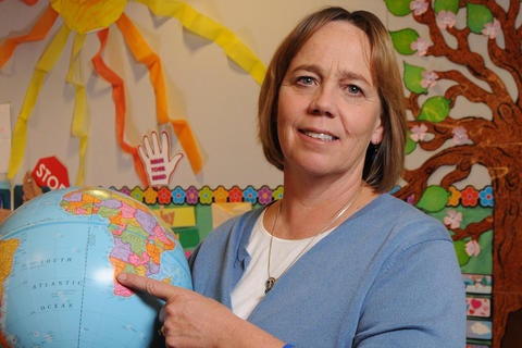 Mary Droser and globe UCR professor Mary Droser